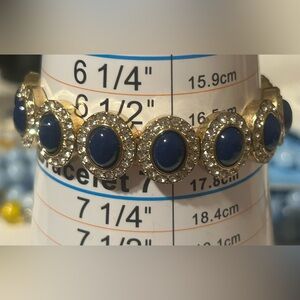 Elegant Brassy Gold Tone and Blue Stone Bracelet
